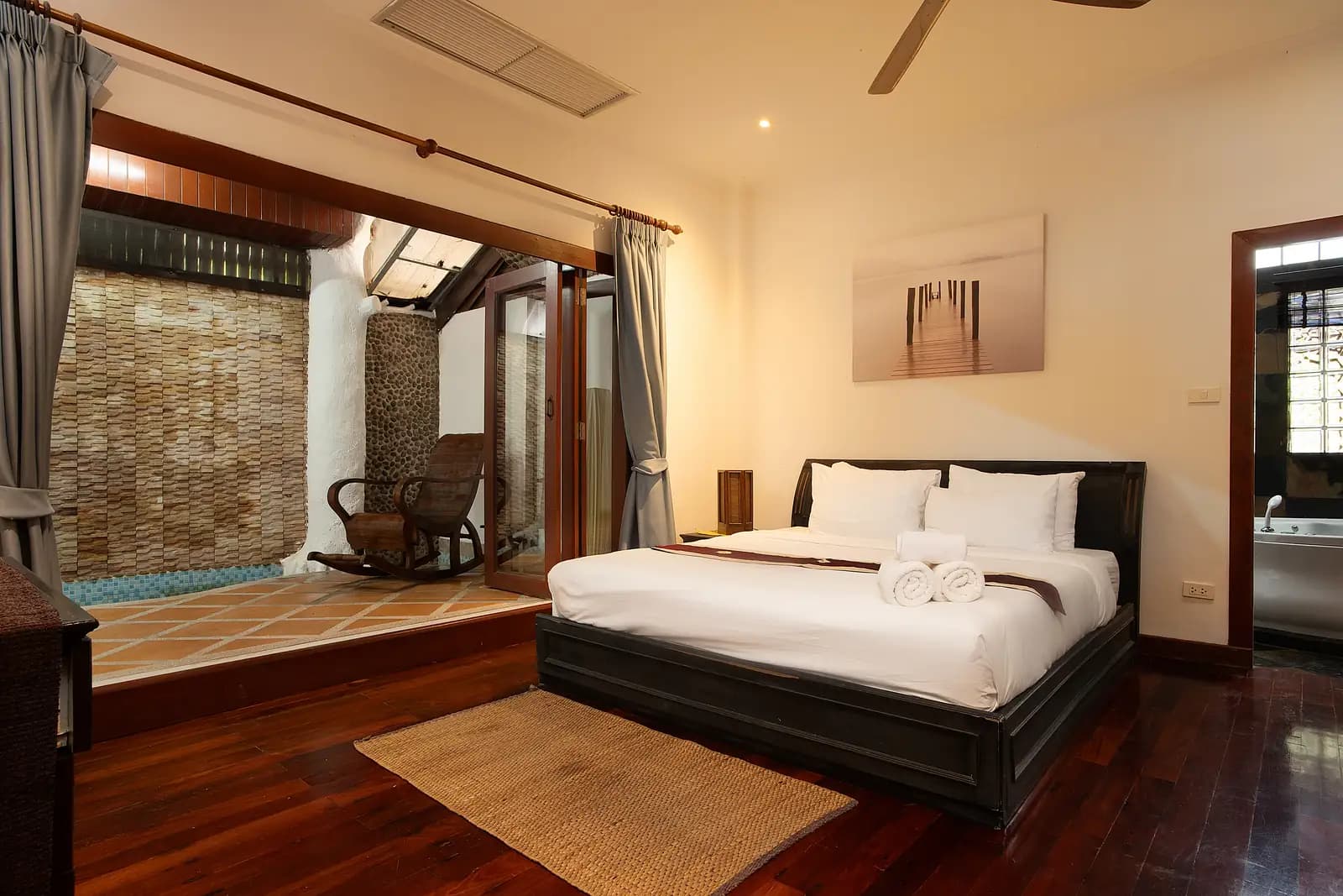 Deluxe Garden Room at The Nai Harn Collective boutique villa hotel in Phuket - Enjoy lush garden views from your private balcony—a calm base for couples or solo travelers.